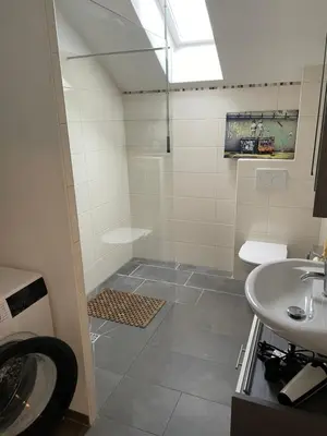 Ein Badezimmer in der Unterkunft Haus Olympia