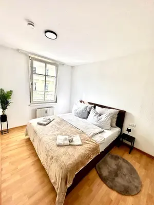 Ein Bett oder Betten in einem Zimmer der Unterkunft Ferienwohnung am Bregenzer Hafen