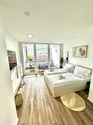 Ein Bett oder Betten in einem Zimmer der Unterkunft Wohnen deluxe mit Pfänderblick