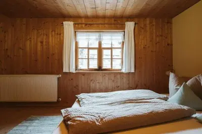 Ein Bett oder Betten in einem Zimmer der Unterkunft Naze`s Hus Mellau