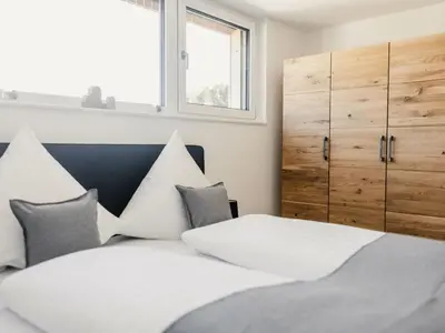 Ein Bett oder Betten in einem Zimmer der Unterkunft Holiday apartment 3 in the holiday home Sandra
