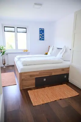 Ein Bett oder Betten in einem Zimmer der Unterkunft Naturidyll am See