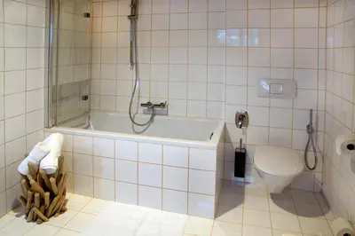 Ein Badezimmer in der Unterkunft Bödele Alpenhotel