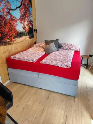 Ein Bett oder Betten in einem Zimmer der Unterkunft Little Tiny Village Haus 2