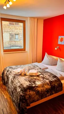 Ein Bett oder Betten in einem Zimmer der Unterkunft Adventure Panorama 
