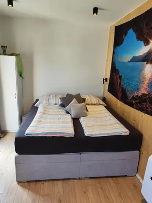Ein Bett oder Betten in einem Zimmer der Unterkunft Little Tiny Village Haus 1
