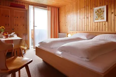 Ein Bett oder Betten in einem Zimmer der Unterkunft Haus Alpenrose