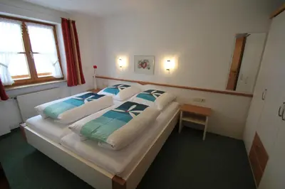 Ein Bett oder Betten in einem Zimmer der Unterkunft Landhaus Conny
