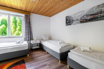Ein Bett oder Betten in einem Zimmer der Unterkunft homy MontaVista - 300m zur Golmerbahn