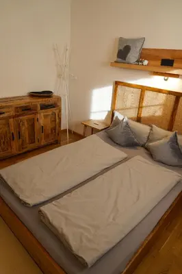 Ein Bett oder Betten in einem Zimmer der Unterkunft Ferienwohnung Am Bach, Riefensberg, Bregenzerwald