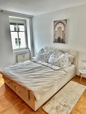 Ein Bett oder Betten in einem Zimmer der Unterkunft Ferienwohnung mit Balkon und Seeblick