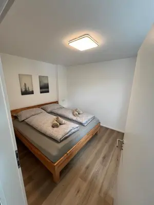 Ein Bett oder Betten in einem Zimmer der Unterkunft Rohrspitz Ferienwohnung