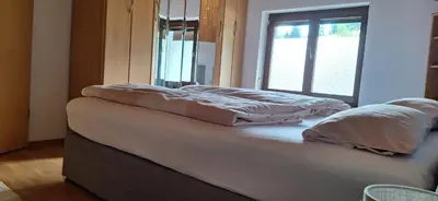 Ein Bett oder Betten in einem Zimmer der Unterkunft Ferienwohnung Heidegger