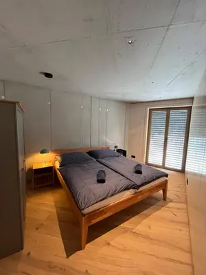 Ein Bett oder Betten in einem Zimmer der Unterkunft Walsergrat Appartements