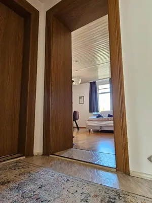 Ein Bett oder Betten in einem Zimmer der Unterkunft Zeitlose Altbauwohnung Bregenz am See