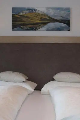 Ein Bett oder Betten in einem Zimmer der Unterkunft Haus Biberkopf