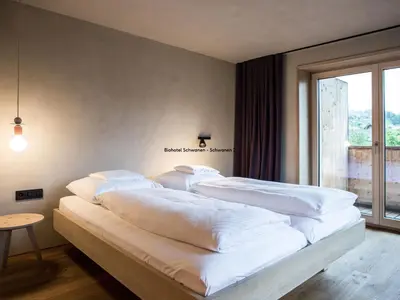 Ein Bett oder Betten in einem Zimmer der Unterkunft Biohotel Schwanen
