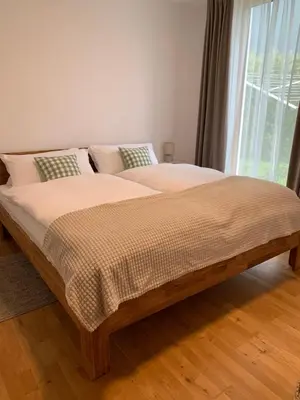 Ein Bett oder Betten in einem Zimmer der Unterkunft Ferienwohnung Alpenglück