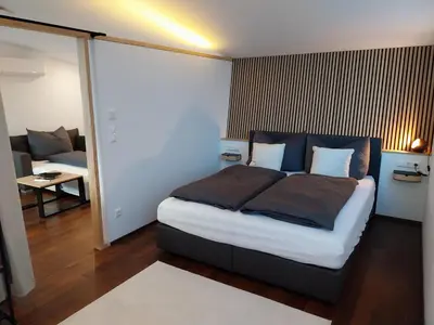 Ein Bett oder Betten in einem Zimmer der Unterkunft Ferienhäuschen Wolfurt