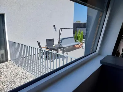 Ein Balkon oder eine Terrasse in der Unterkunft Ferienhäuschen Wolfurt
