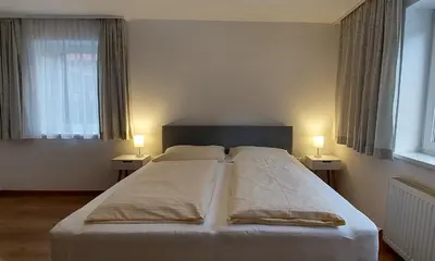 Ein Bett oder Betten in einem Zimmer der Unterkunft Saroja Plus