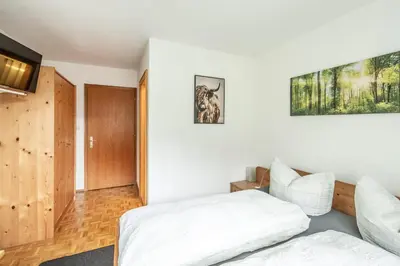 Ein Bett oder Betten in einem Zimmer der Unterkunft Pension Stein nahe Feldkirch ruhige Zimmer für Reisende und Monteure inklusive Frühstück