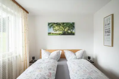 Ein Bett oder Betten in einem Zimmer der Unterkunft Pension Stein nahe Feldkirch ruhige Zimmer für Reisende und Monteure inklusive Frühstück