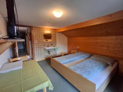 Ein Bett oder Betten in einem Zimmer der Unterkunft Haus Isabella