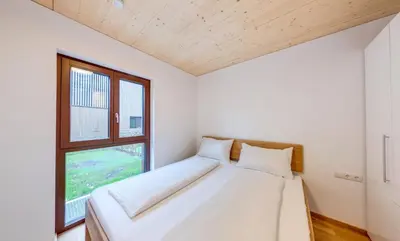 Ein Bett oder Betten in einem Zimmer der Unterkunft Urban-Apartmenthaus zwischen Berg und See