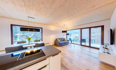 Ein Sitzbereich in der Unterkunft Urban-Apartmenthaus zwischen Berg und See