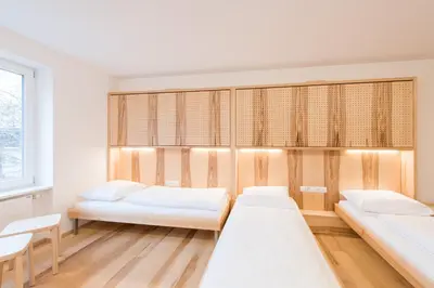 Ein Bett oder Betten in einem Zimmer der Unterkunft Bildungshaus Arbogast