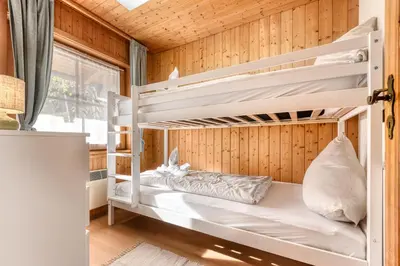 Ein Bett oder Betten in einem Zimmer der Unterkunft Panorama Ferienhaus Zentral