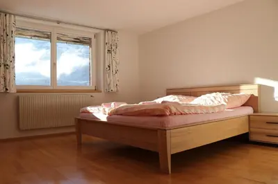 Ein Bett oder Betten in einem Zimmer der Unterkunft Andis Bünt