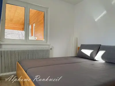 Ein Bett oder Betten in einem Zimmer der Unterkunft Ferienwohnung Alphome Rankweil