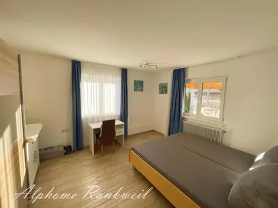 Ein Bett oder Betten in einem Zimmer der Unterkunft Ferienwohnung Alphome Rankweil