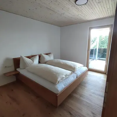 Ein Bett oder Betten in einem Zimmer der Unterkunft Weitblickhof Roth