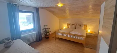 Ein Bett oder Betten in einem Zimmer der Unterkunft Ferienwohnung Meusburger