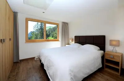 Ein Bett oder Betten in einem Zimmer der Unterkunft Appartement Rothornblick