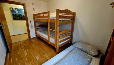 Ein Bett oder Betten in einem Zimmer der Unterkunft Haus Mangeng
