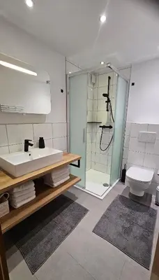 Ein Badezimmer in der Unterkunft Haus Mangeng