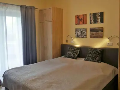 Ein Bett oder Betten in einem Zimmer der Unterkunft Sonnalpin Waldhaus holiday residence