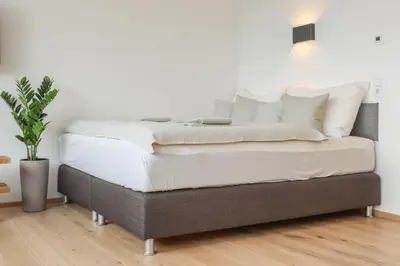 Ein Bett oder Betten in einem Zimmer der Unterkunft Säntisblick Apartment