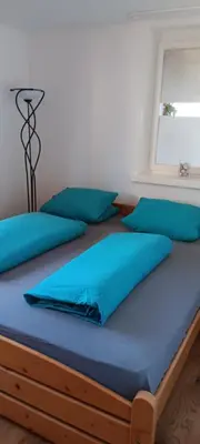 Ein Bett oder Betten in einem Zimmer der Unterkunft Ländle-Appartement
