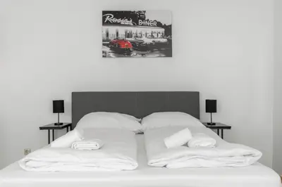 Ein Bett oder Betten in einem Zimmer der Unterkunft homy Downtown Elegance