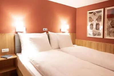 Ein Bett oder Betten in einem Zimmer der Unterkunft Forsthaus Waldesruh