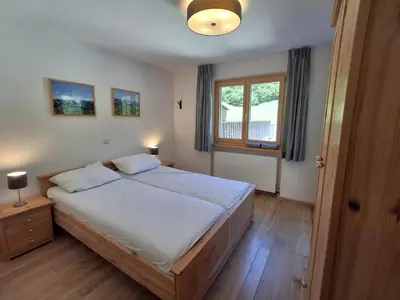 Ein Bett oder Betten in einem Zimmer der Unterkunft Ferienwohnung Almrausch by Alpenfeder