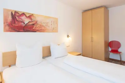 Ein Bett oder Betten in einem Zimmer der Unterkunft Gästehaus Sahin 3 by Alpenfeder
