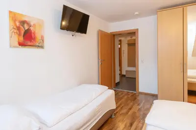 Ein Bett oder Betten in einem Zimmer der Unterkunft Gästehaus Sahin 3 by Alpenfeder