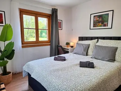 Ein Bett oder Betten in einem Zimmer der Unterkunft Lake Family and Group Apartments