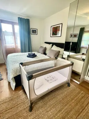 Ein Bett oder Betten in einem Zimmer der Unterkunft Lake Family and Group Apartments